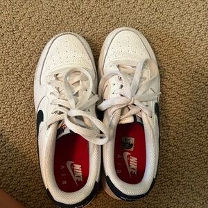 Nike air forces with blue swish